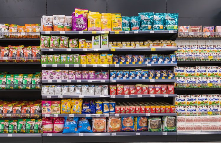 Pet foods on shelves at a grocery store